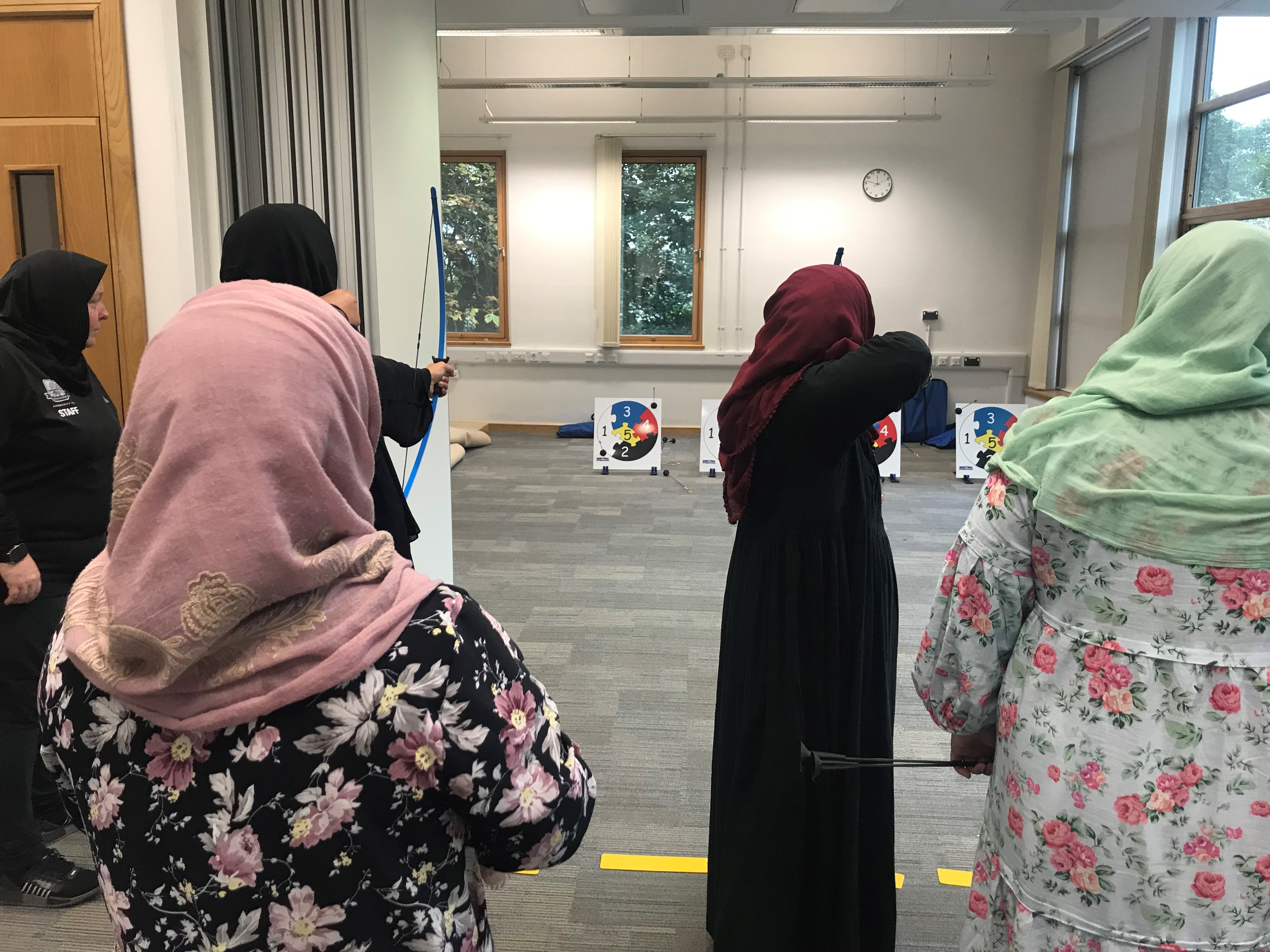 Women and girls trying soft archery